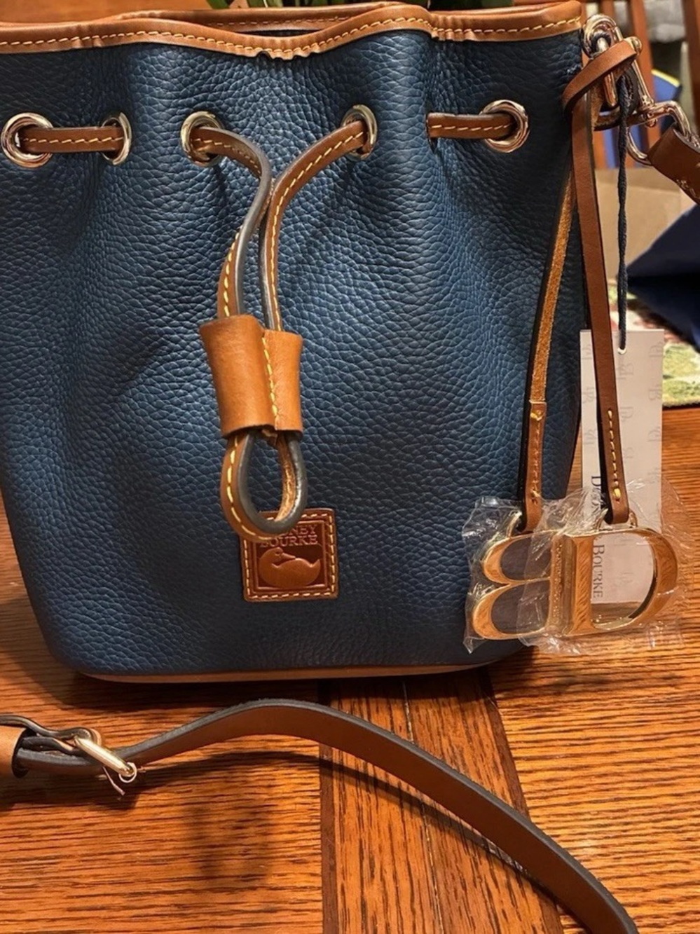 Dooney & Bourke Navy Pebble Leather Drawstring Bucket Bag with Tan Trim